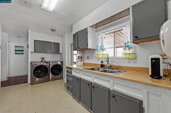a kitchen with stainless steel appliances granite countertop a stove and a sink