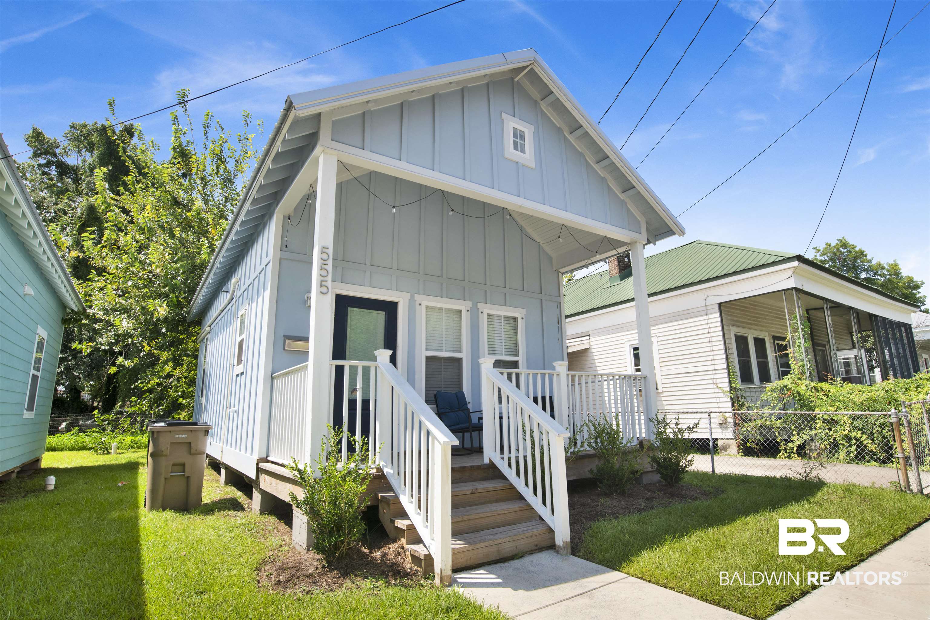 555 Congress Street Mobile, AL 36603 - Photo 2 of 27 View of front facade featuring board and batten siding and a metal roof