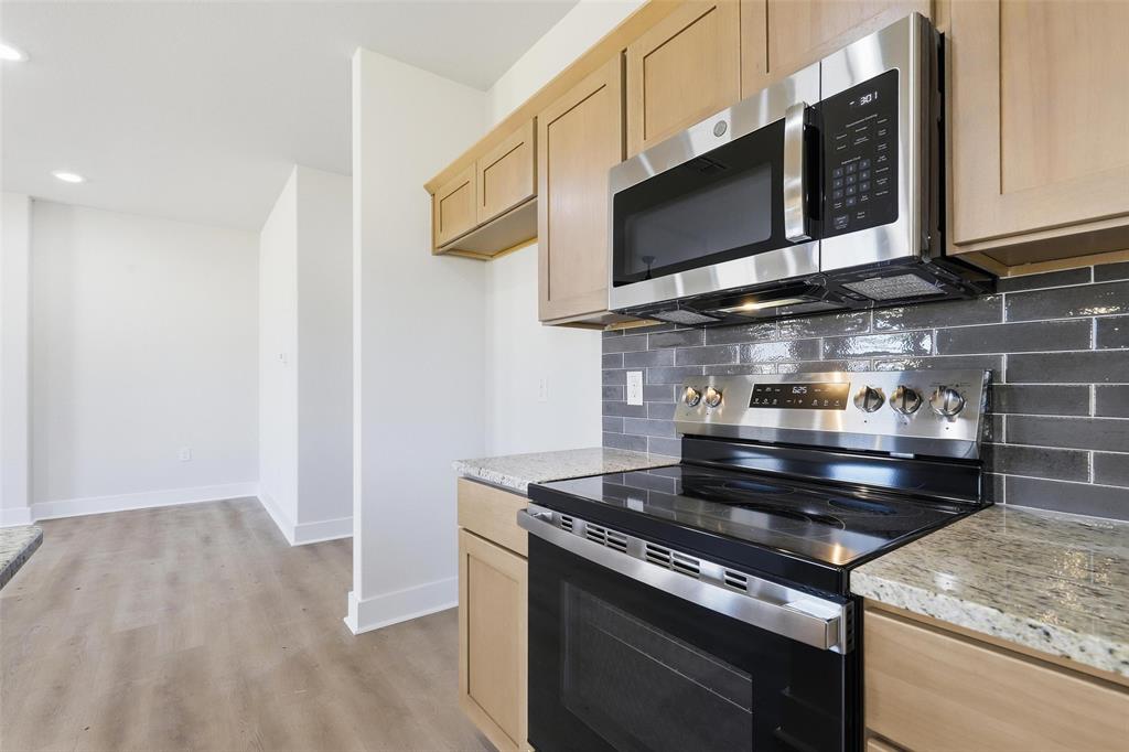 472 Peace Lily Way Tolar, TX 76476 - Photo 12 of 40 a stove top oven sitting inside of a kitchen