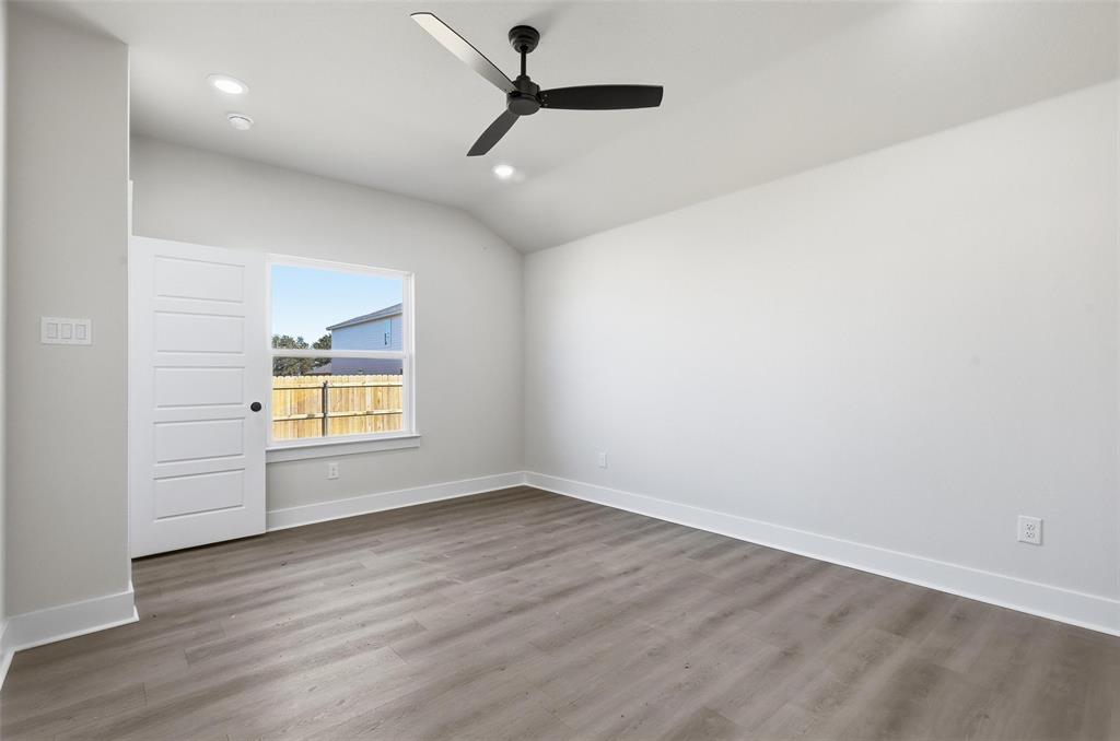 472 Peace Lily Way Tolar, TX 76476 - Photo 20 of 40 wooden floor in an empty room with a window