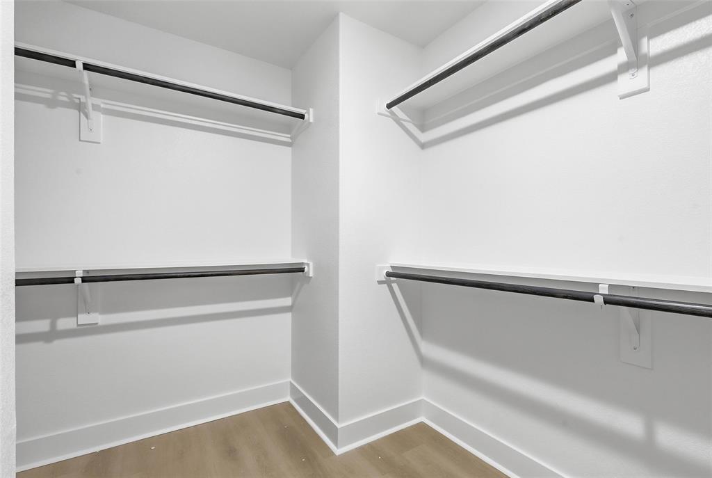 472 Peace Lily Way Tolar, TX 76476 - Photo 23 of 40 a view of walk in closet with empty racks