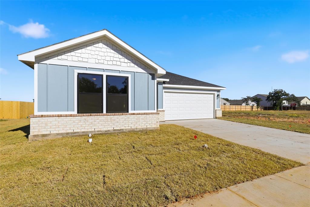 472 Peace Lily Way Tolar, TX 76476 - Photo 38 of 40 a front view of a house with a yard