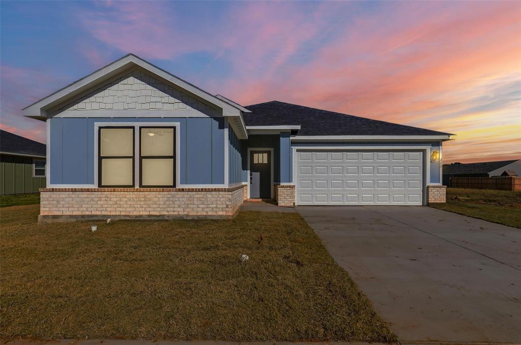 472 Peace Lily Way Tolar, TX 76476 - Photo 40 of 40 a front view of a house with a yard and garage