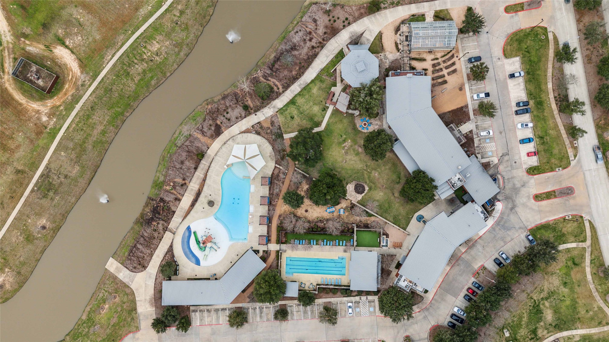 2711 Merlin Way Katy, TX 77493 - Photo 48 of 50 Amenity center with on-site restaurant, fitness center, lap pool, splash pad and resort style pool.