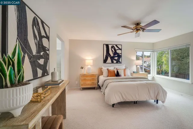 a bedroom with furniture and a window