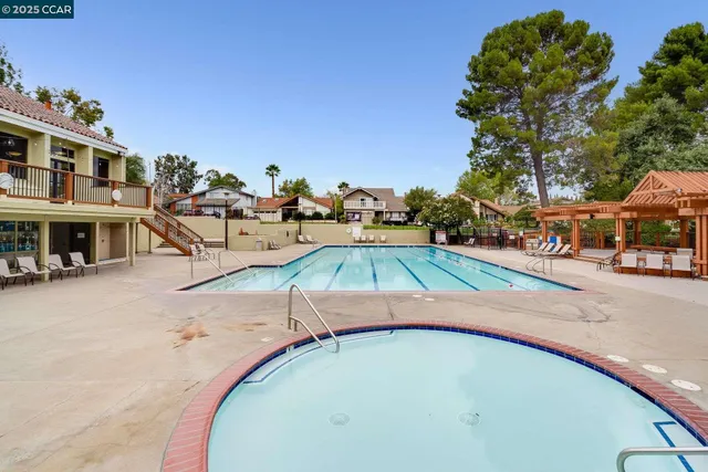 an aerial view of a house with swimming pool