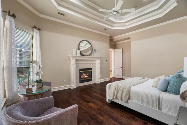 a bedroom with a bed and a fireplace