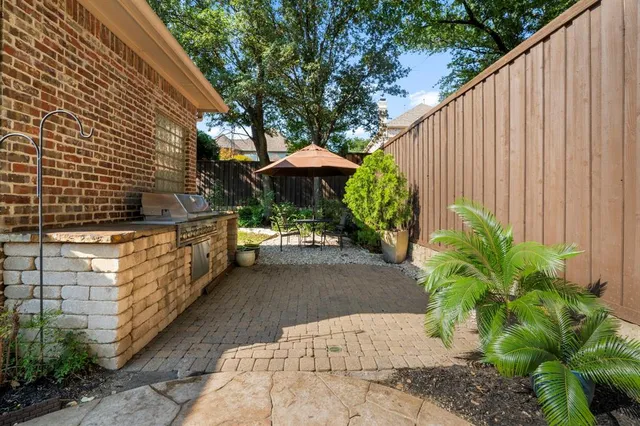 a view of a garden with an outdoor seating