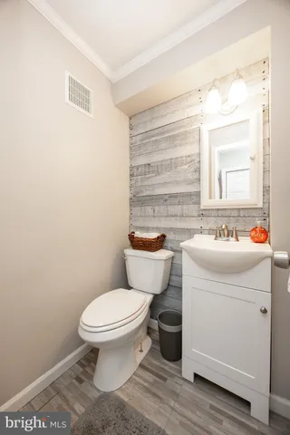 a livingroom with workspace and a window