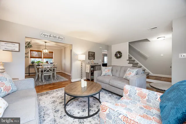 a kitchen with stainless steel appliances granite countertop wooden floors and sink