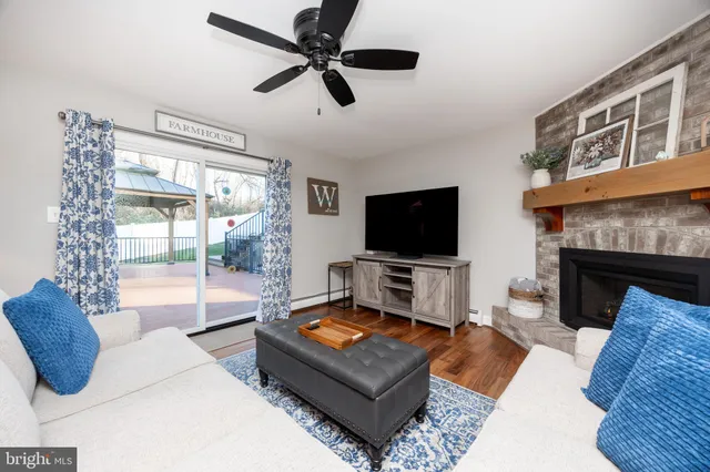 a bathroom with a sink a toilet and a window