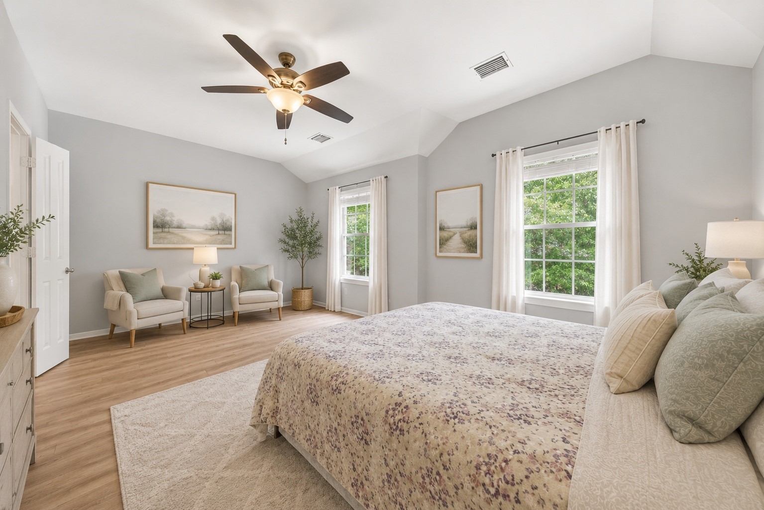 38 Musgrove Place Spring, TX 77382 - Photo 14 of 36 Sunlit primary bedroom with vaulted ceiling, ceiling fan, and oversized windows overlooking leafy views.