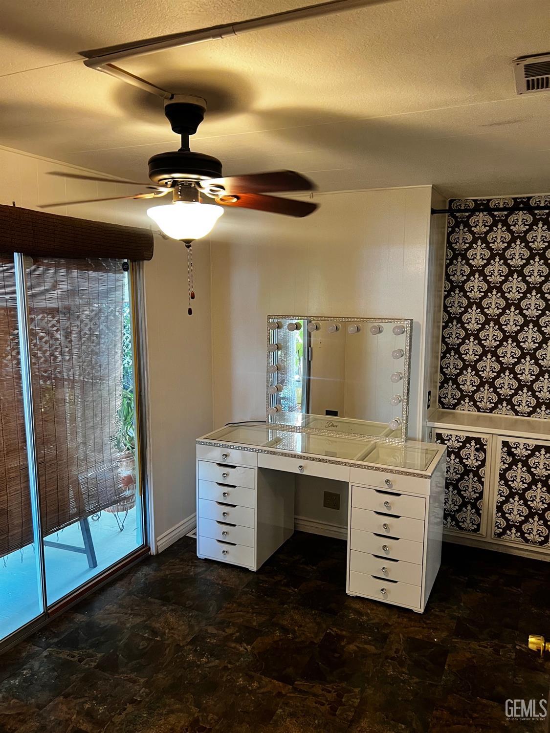 Undisclosed Address Bakersfield, CA 93306 - Photo 6 of 9 a kitchen with a stove and a chandelier