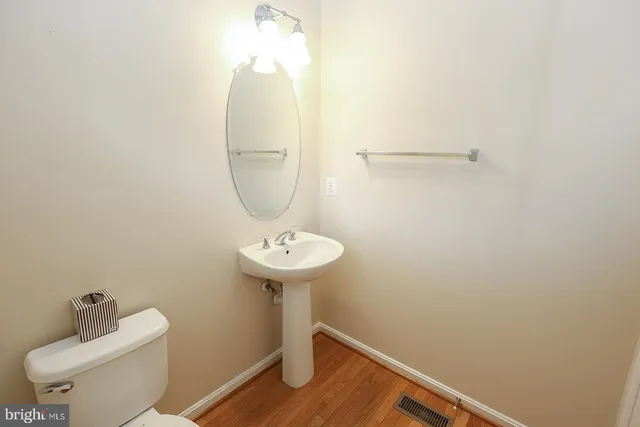 a kitchen with stainless steel appliances granite countertop a sink a stove and cabinets