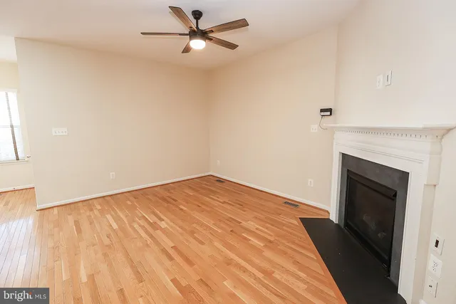 a kitchen with granite countertop a stove a sink and dishwasher wooden cabinets with granite countertops