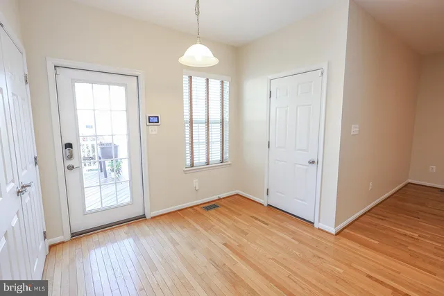 a bathroom with a granite countertop toilet and a sink