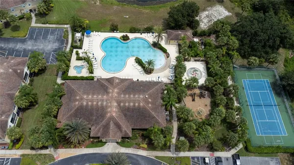 an aerial view of residential houses with outdoor space