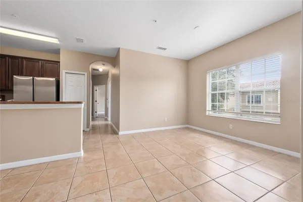 a view of a kitchen with an empty space and a window