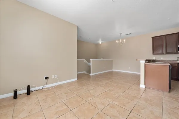 a view of a kitchen with microwave and cabinets