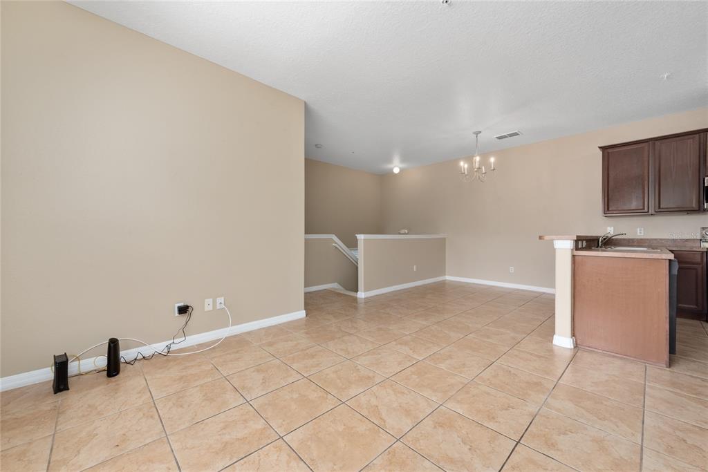 7531 Pellham Way, Unit 77 Kissimmee, FL 34747 - Photo 7 of 28 a view of a kitchen with microwave and cabinets