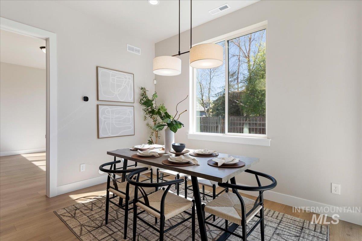 901 West Malbar Street Meridian, ID 83646 - Photo 8 of 33 Dining area with baseboards and light wood-style floors