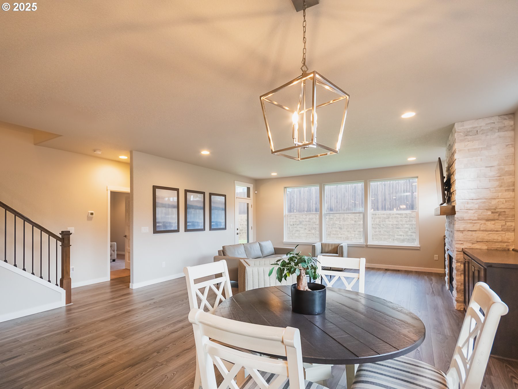 2116 North 3rd Way Ridgefield, WA 98642 - Photo 17 of 40 a view of a dining room with furniture window and wooden floor