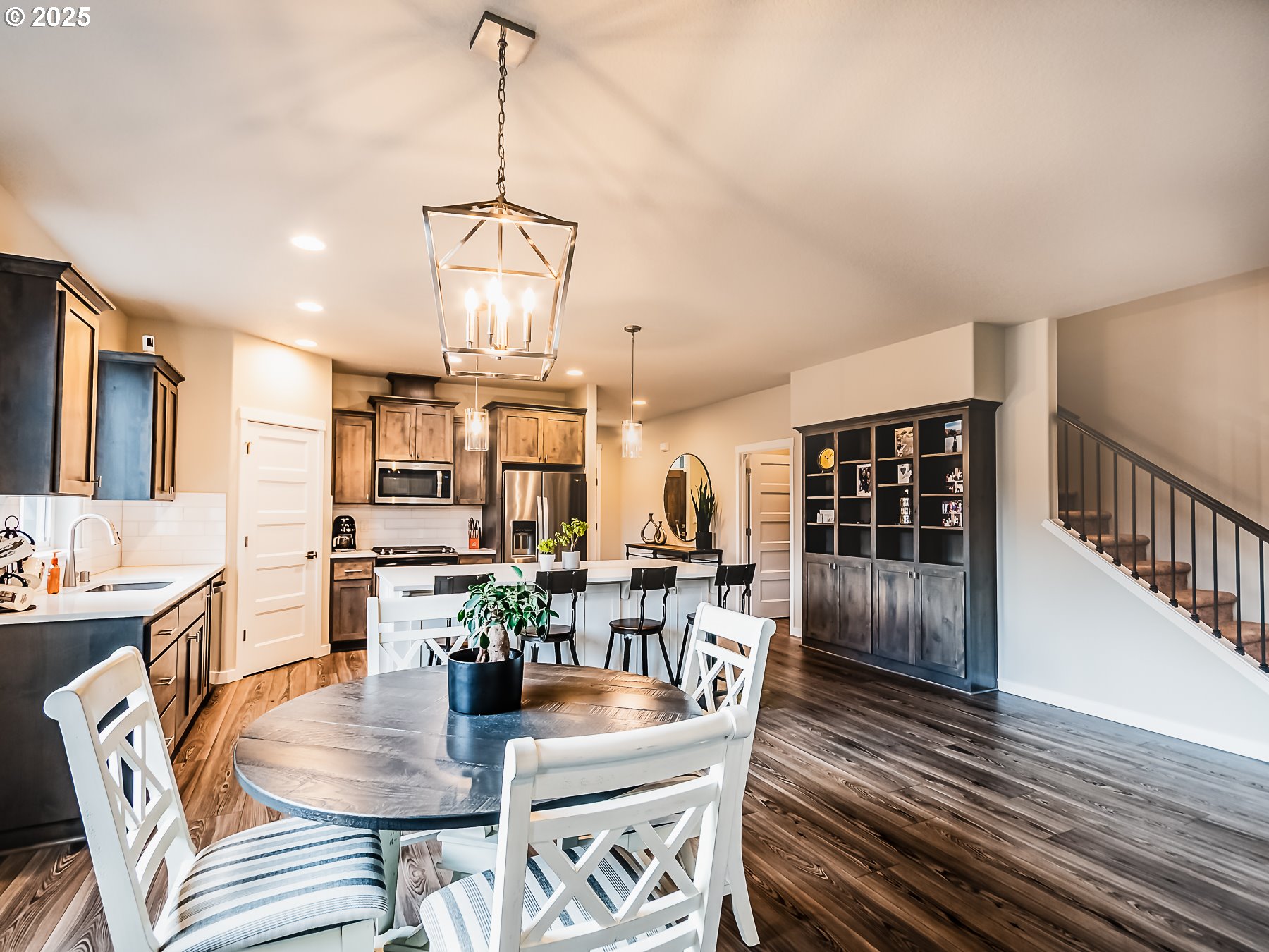 2116 North 3rd Way Ridgefield, WA 98642 - Photo 18 of 40 a view of a dining room with furniture window and wooden floor