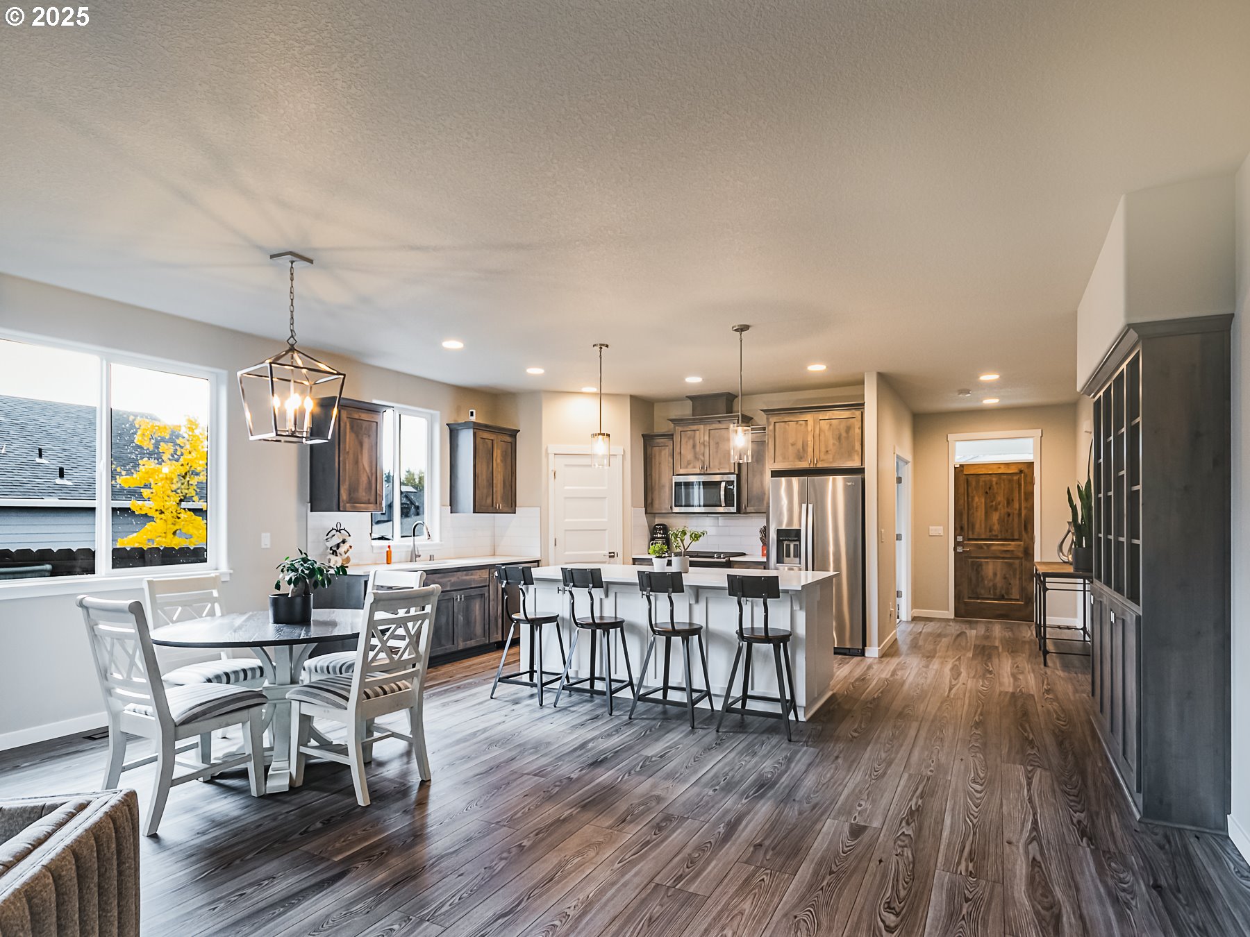 2116 North 3rd Way Ridgefield, WA 98642 - Photo 22 of 40 a view of a dining room with furniture window and wooden floor