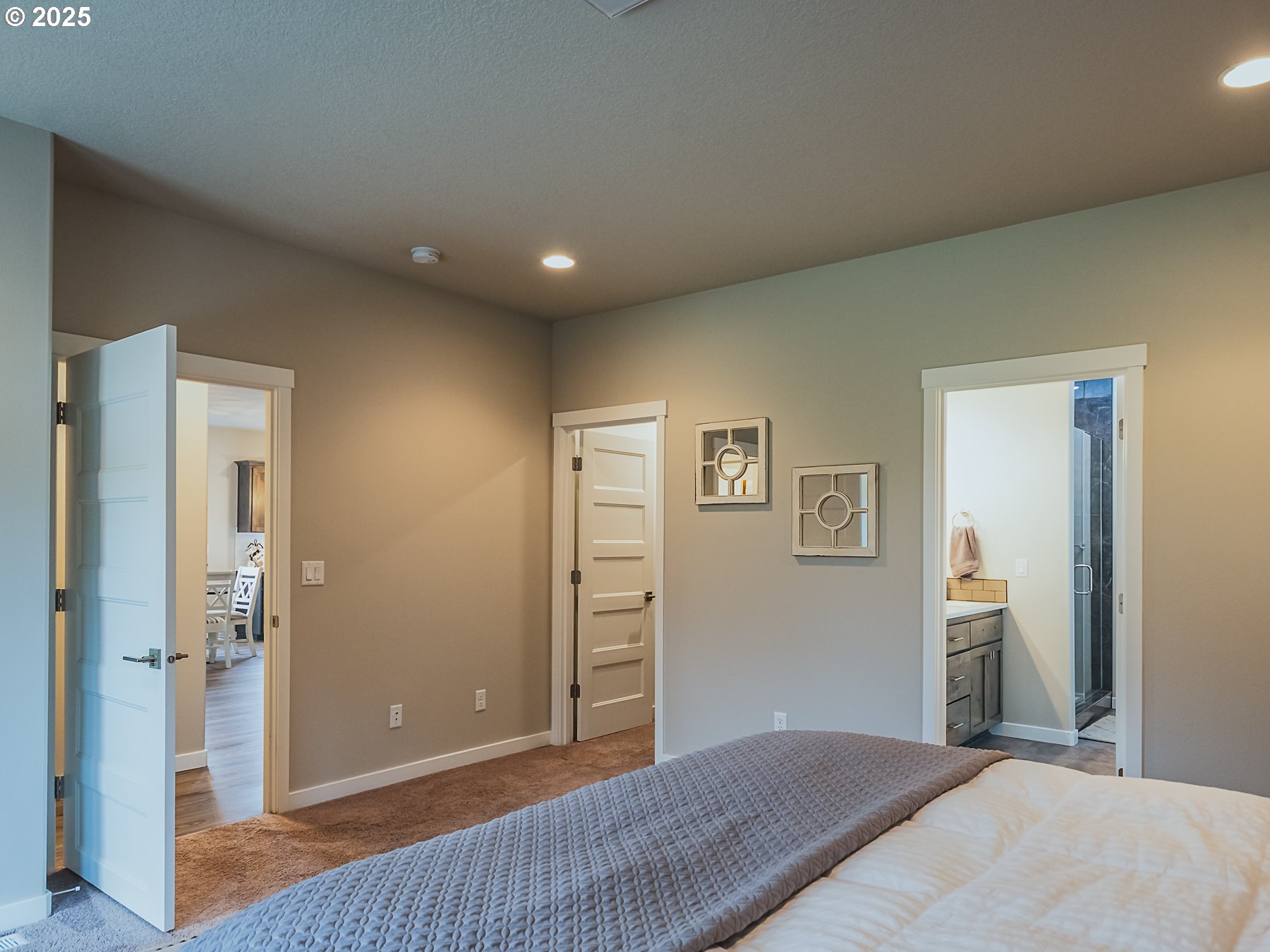 2116 North 3rd Way Ridgefield, WA 98642 - Photo 26 of 40 a bedroom with a bed and cabinets
