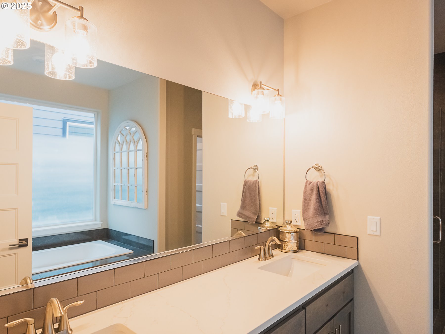 2116 North 3rd Way Ridgefield, WA 98642 - Photo 27 of 40 a bathroom with a sink and a mirror