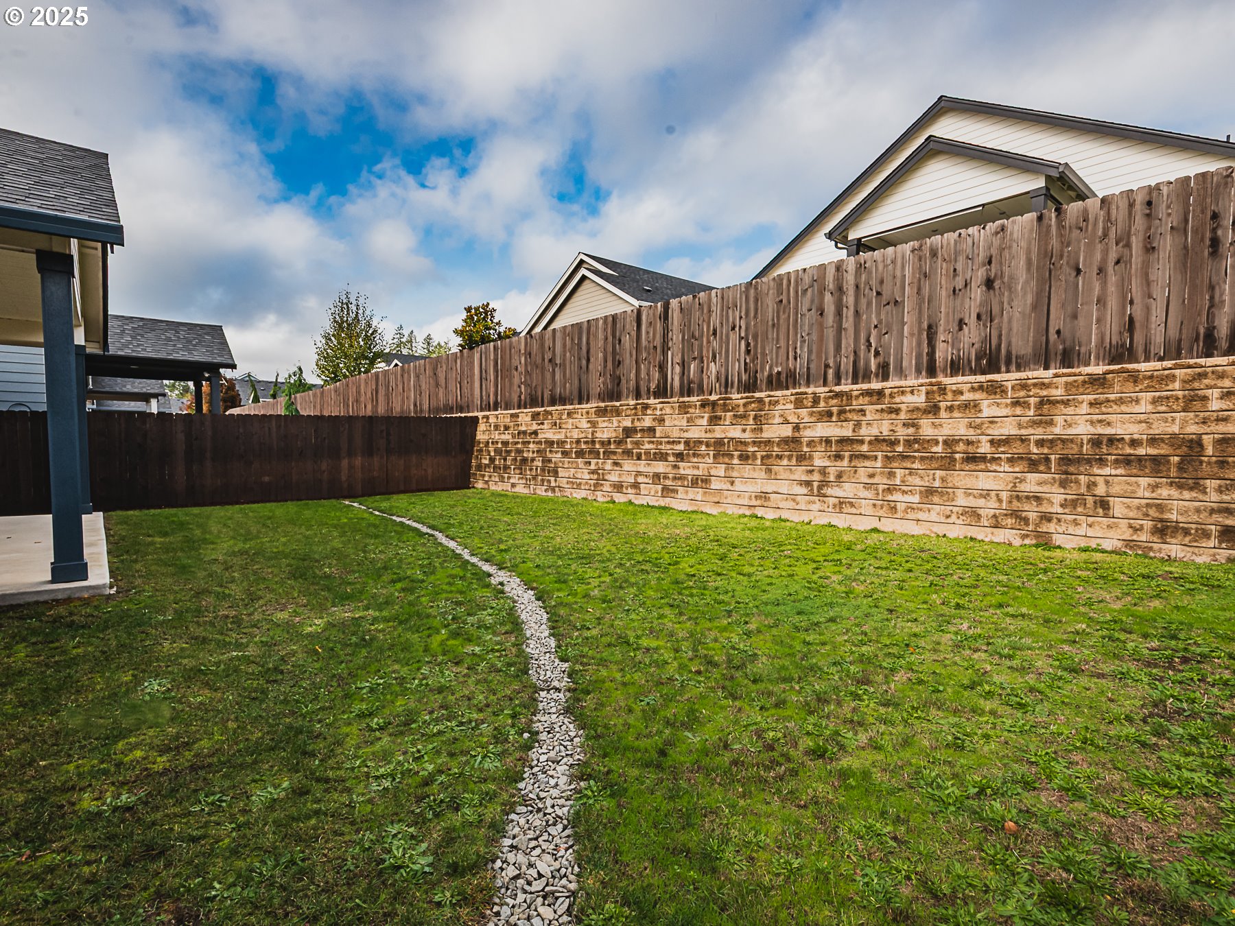 2116 North 3rd Way Ridgefield, WA 98642 - Photo 34 of 40 a view of backyard with a garden and wooden fence