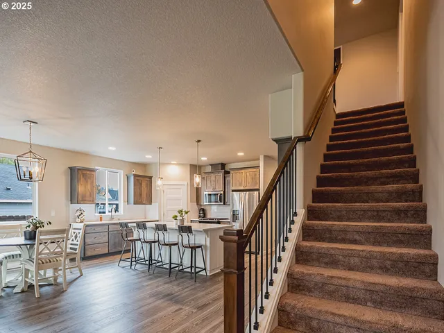 a view of kitchen and dining room with wooden floor