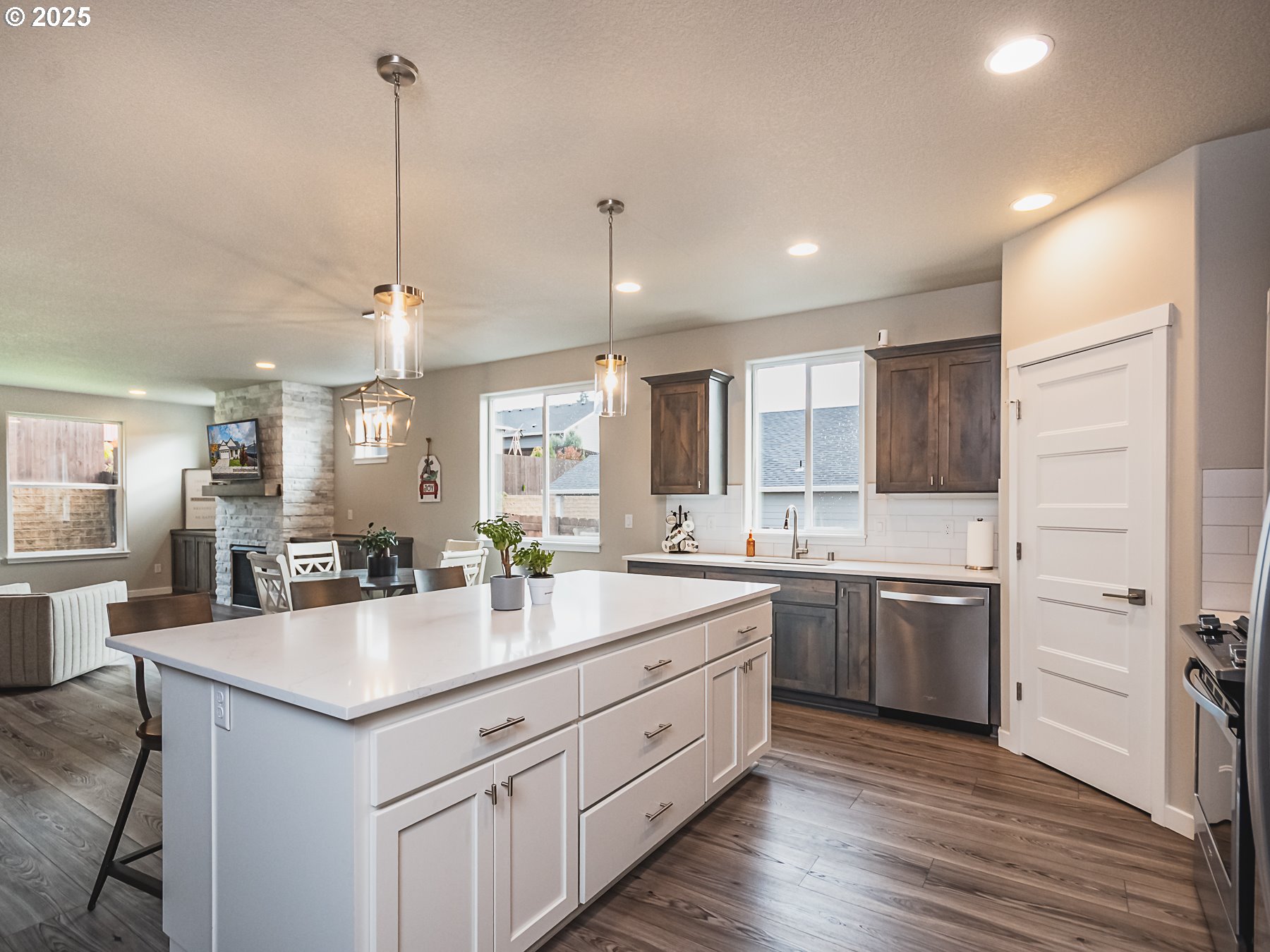 2116 North 3rd Way Ridgefield, WA 98642 - Photo 7 of 40 a kitchen with a sink stove and wooden floor