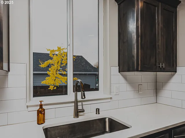 a bathroom with a sink and mirror