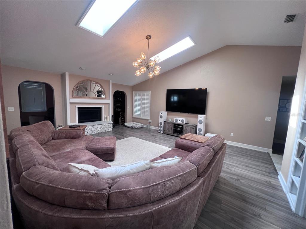 357 Tymber Run Ormond Beach, FL 32174 - Photo 10 of 32 a living room with furniture and a flat screen tv