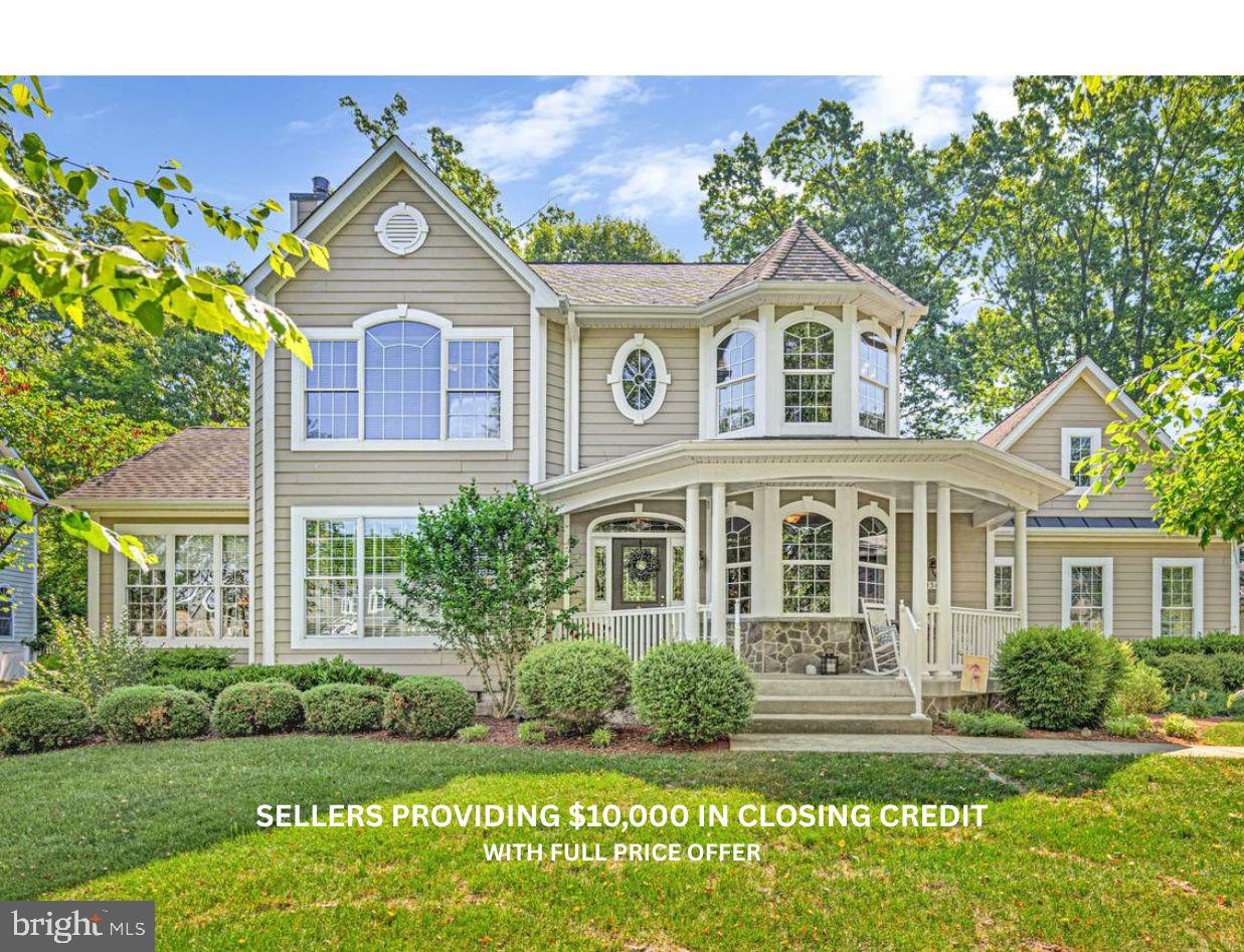 11565 Magnolia Court Issue, MD 20645 - Photo 2 of 68 a front view of a house with a yard