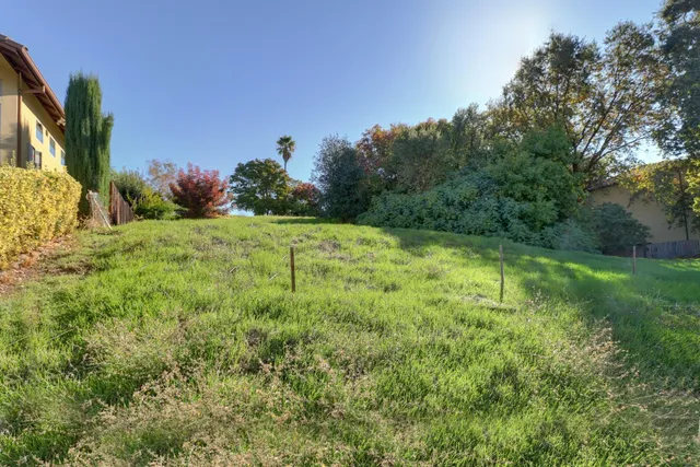 a view of an house with outdoor space and parking
