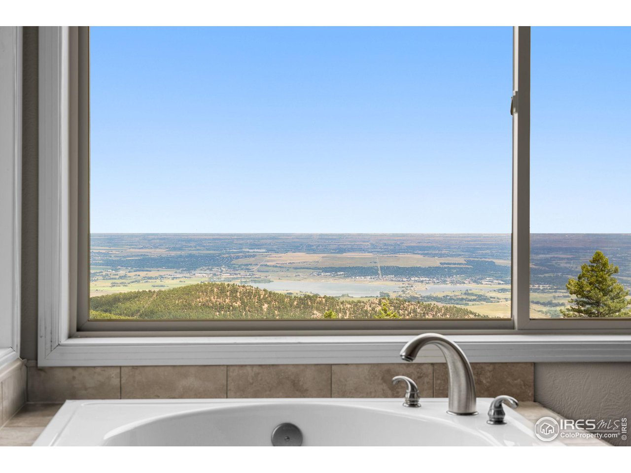 309 Sunrise Lane Boulder, CO 80302 - Photo 16 of 40 a view of a balcony with an ocean view