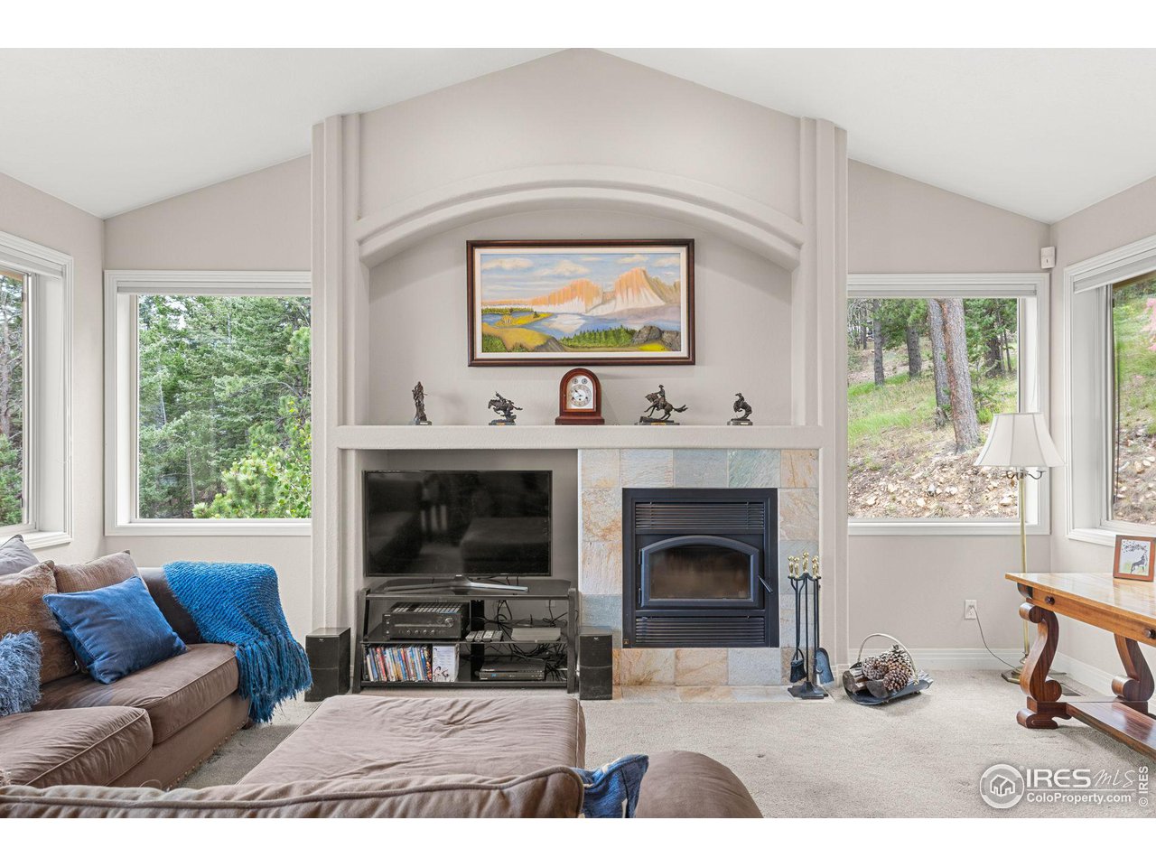 309 Sunrise Lane Boulder, CO 80302 - Photo 2 of 40 a living room with furniture a window and a fireplace