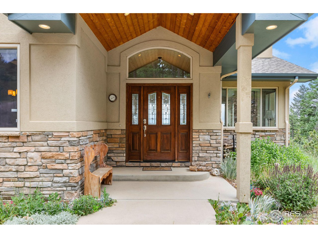 309 Sunrise Lane Boulder, CO 80302 - Photo 21 of 40 a front view of a house with a garden