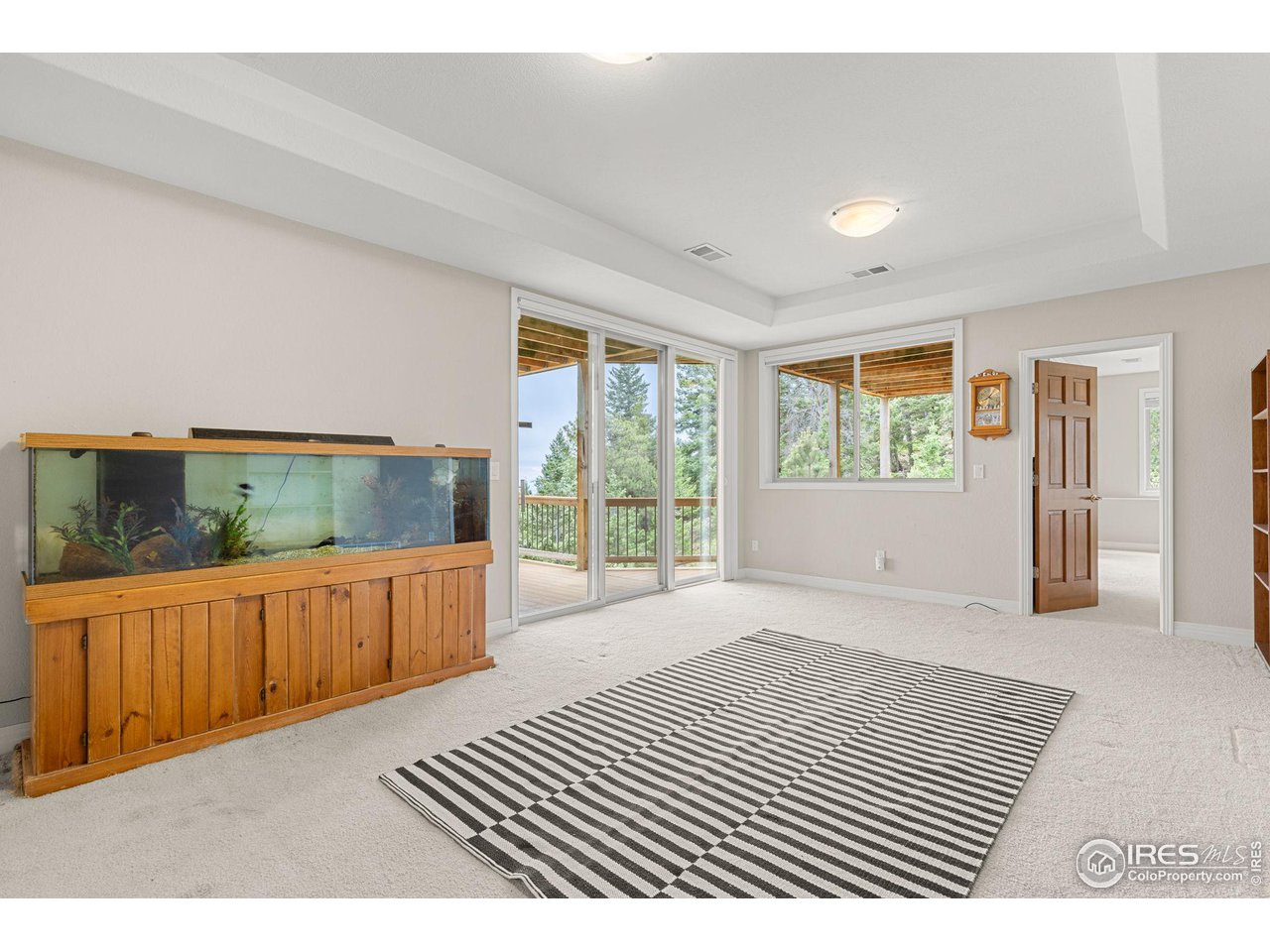 309 Sunrise Lane Boulder, CO 80302 - Photo 33 of 40 a view of a bedroom with wooden floor and furniture