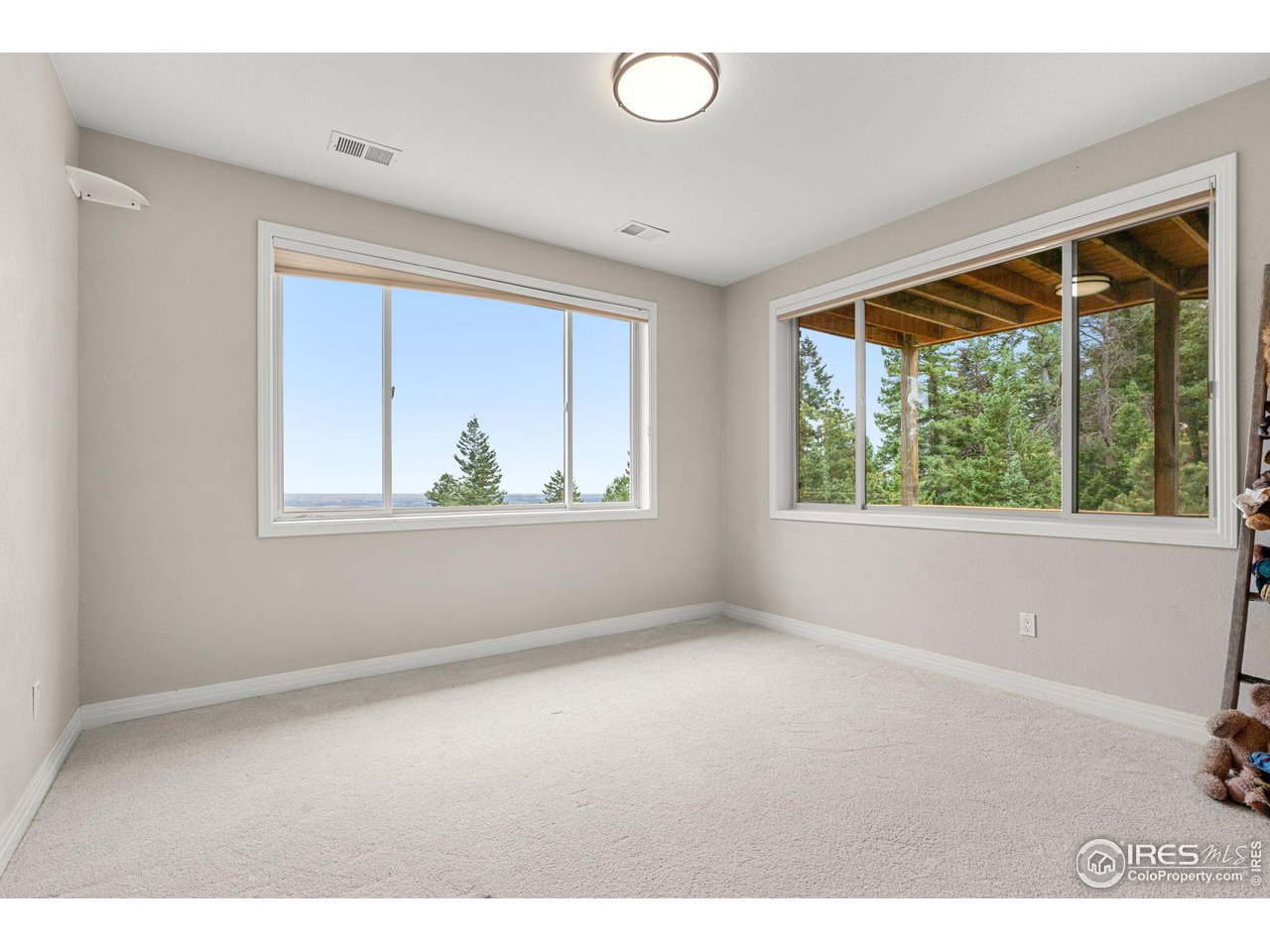 309 Sunrise Lane Boulder, CO 80302 - Photo 35 of 40 an empty room with windows