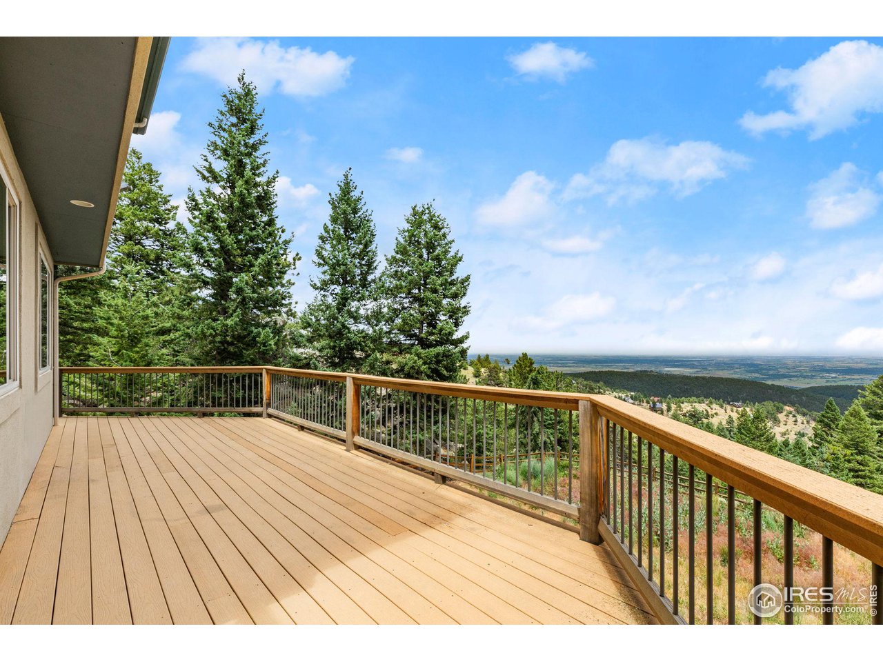 309 Sunrise Lane Boulder, CO 80302 - Photo 6 of 40 a view of balcony with wooden floor and fence