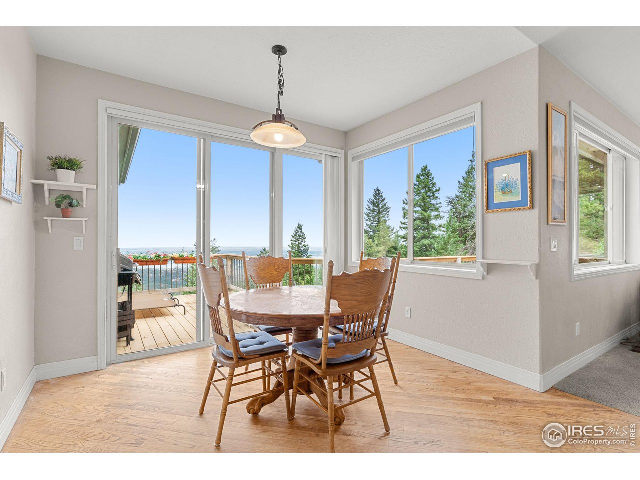 309 Sunrise Lane Boulder, CO 80302 - Photo 7 of 40 a dining room with furniture window wooden floor