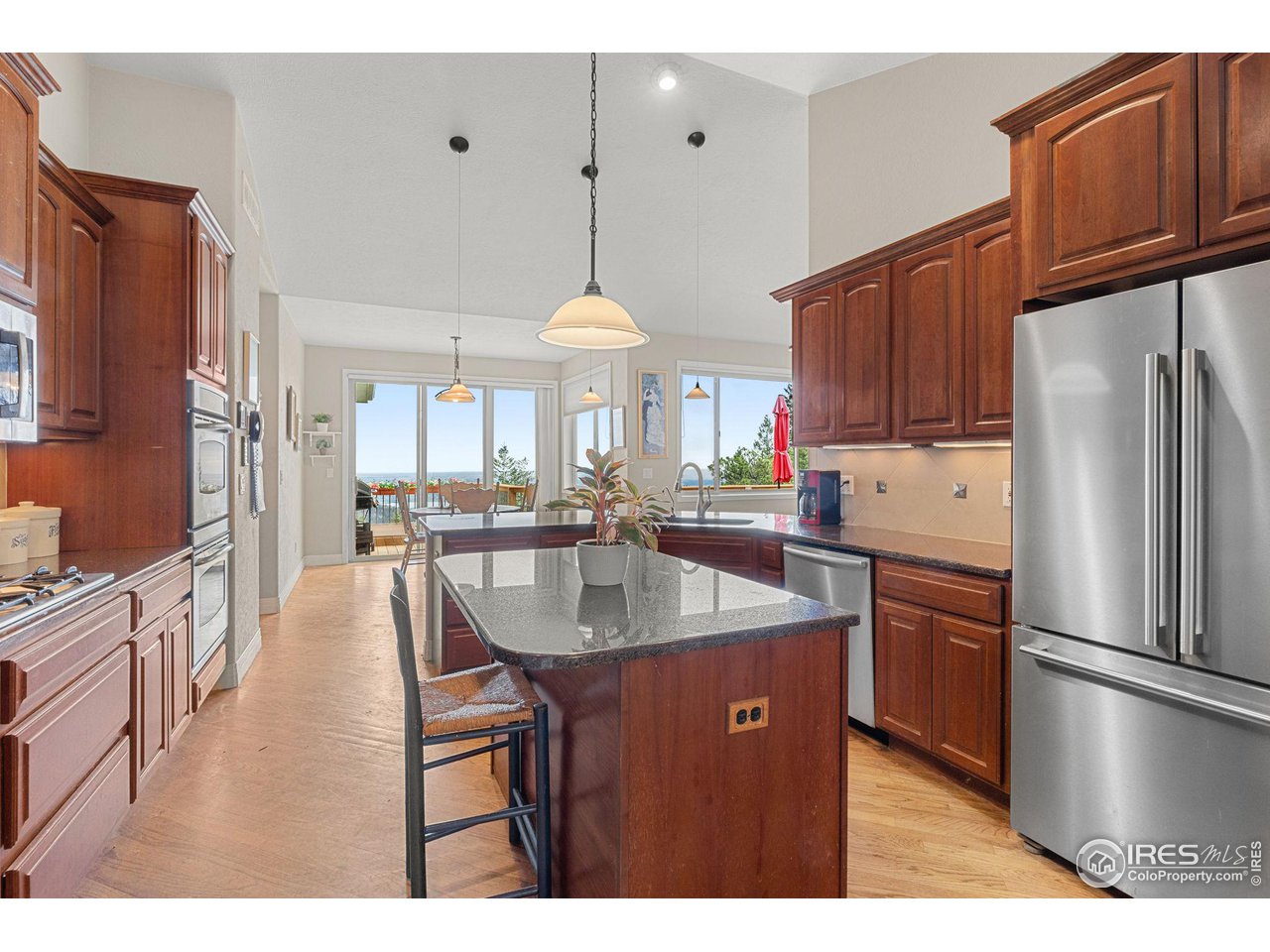 309 Sunrise Lane Boulder, CO 80302 - Photo 8 of 40 a kitchen with stainless steel appliances granite countertop a sink refrigerator and cabinets