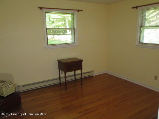 23 Swoyer Road Lake Ariel, PA 18436 - Photo 14 of 28 an empty room with wooden floor and windows