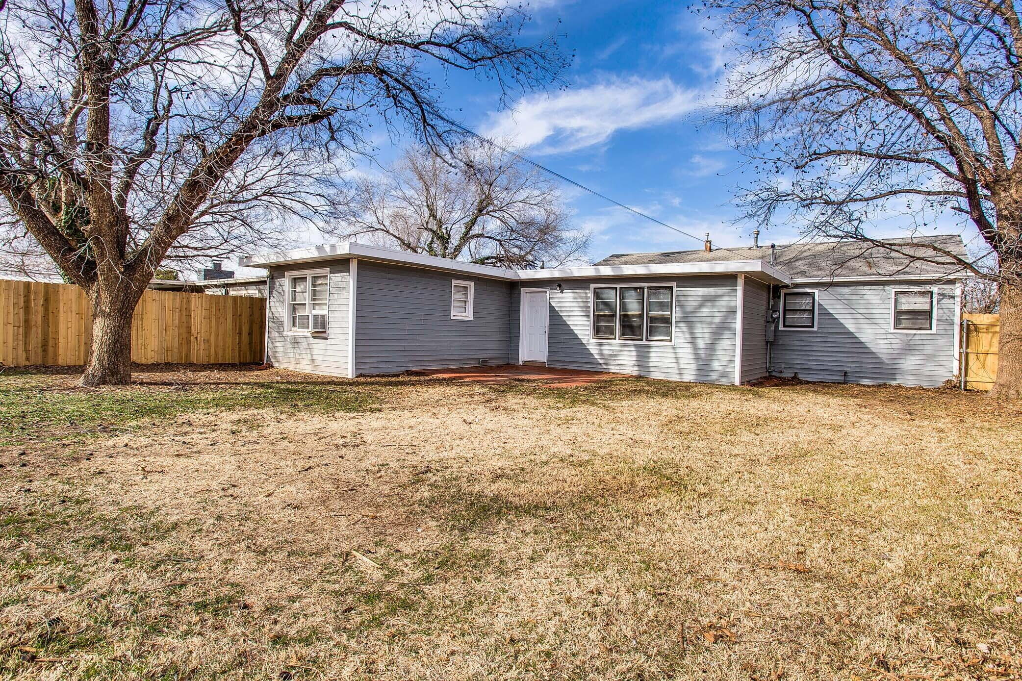 4315 32nd Street Lubbock, TX 79410 - Photo 15 of 15 a house with trees in front of it