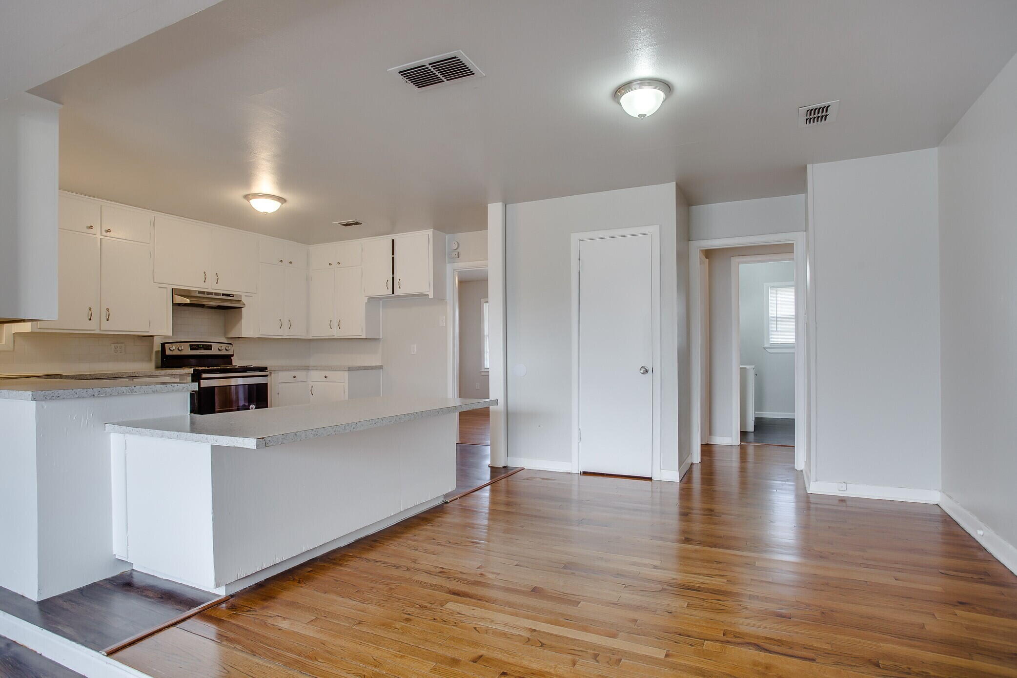 4315 32nd Street Lubbock, TX 79410 - Photo 6 of 15 a view of kitchen with stainless steel appliances refrigerator stove microwave and cabinets