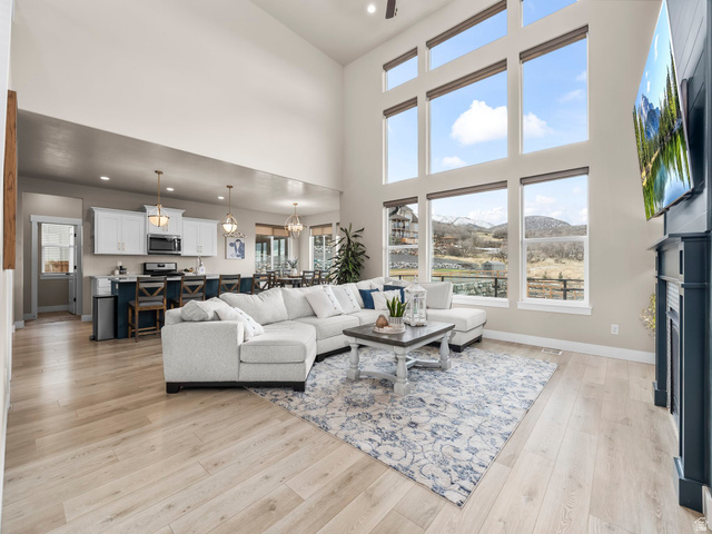 102 Elk Ridge Drive Elk Ridge, UT 84651 - Photo 5 of 61 Great room with large windows and electric shades!