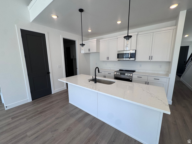 1301 1475 East, Unit 33 Payson, UT 84651 - Photo 4 of 10 Kitchen featuring a central island with an undermount sink, quartz countertops, white cabinetry, stainless steel appliances, and recessed lighting